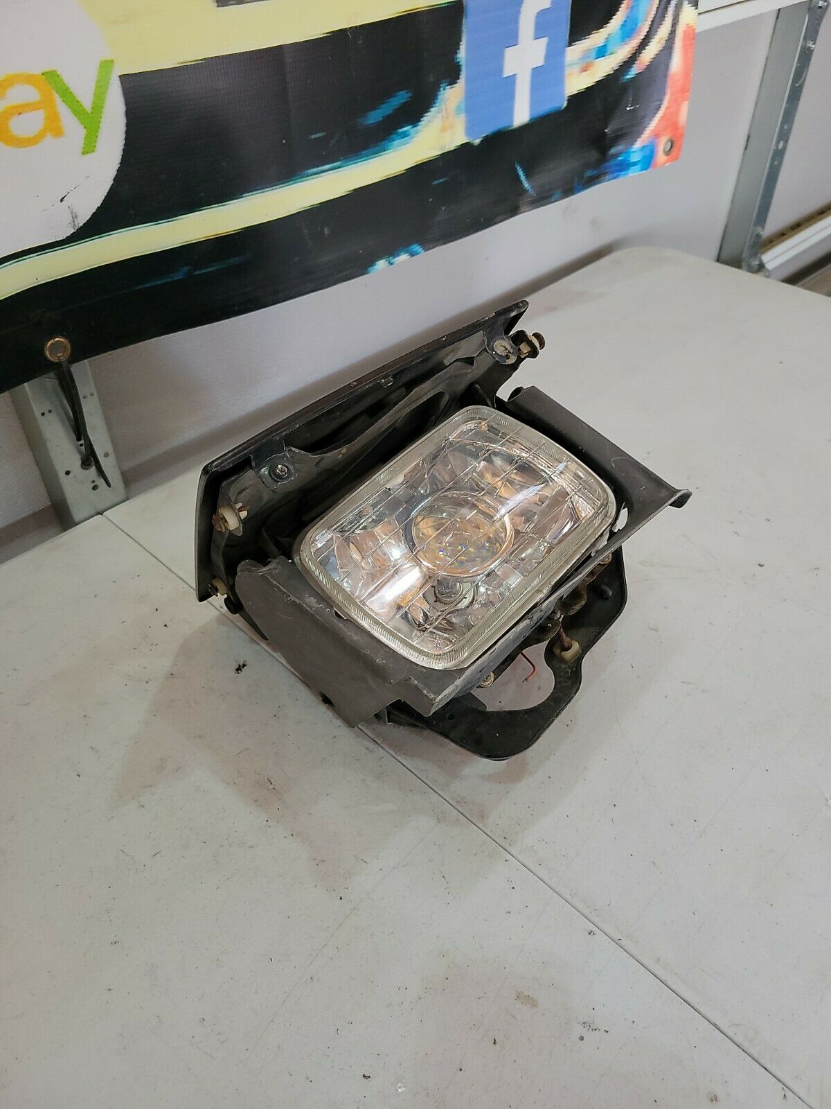 1987 MAZDA RX7 FC left driver headlight